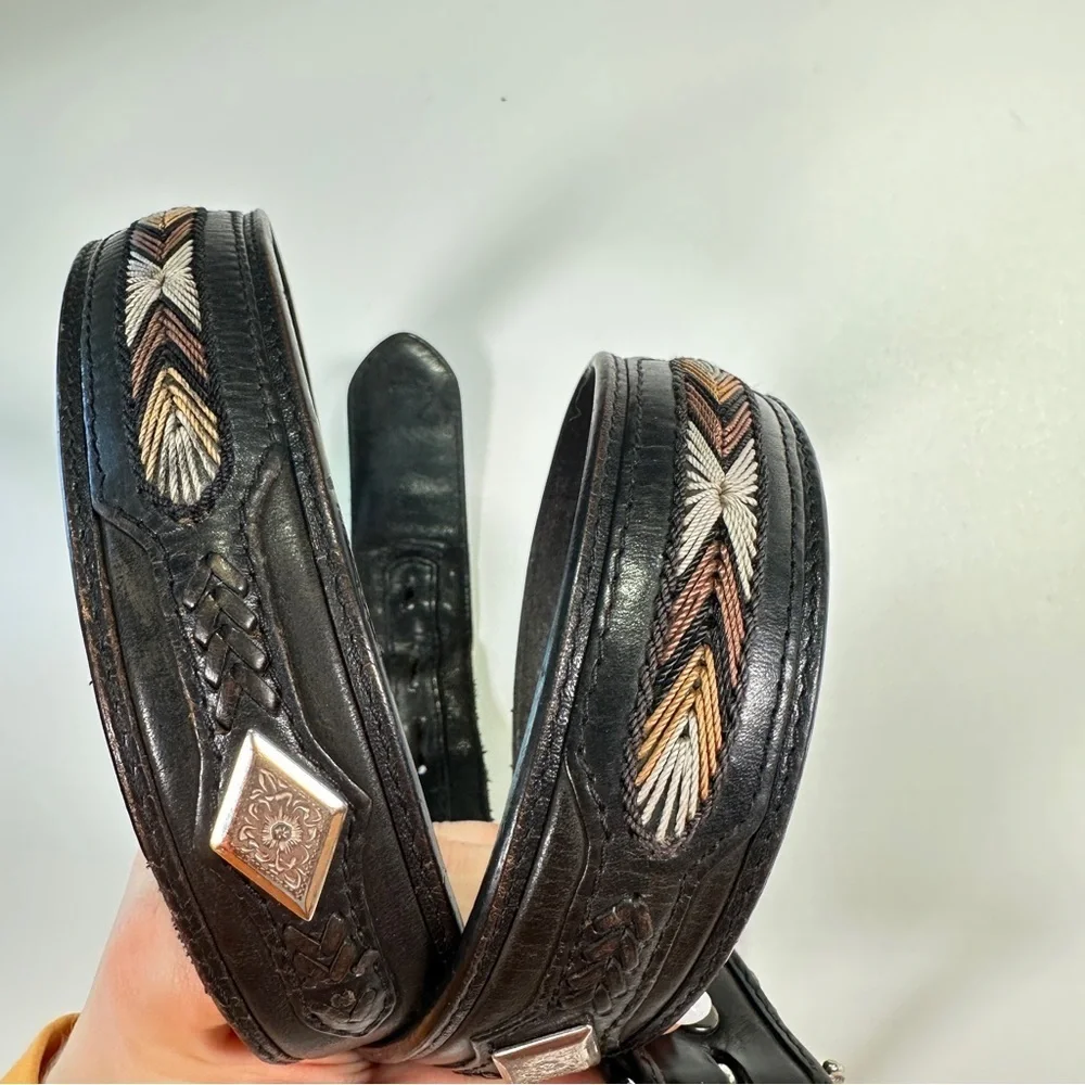 Black Leather Belt with Intricate Silver Buckle